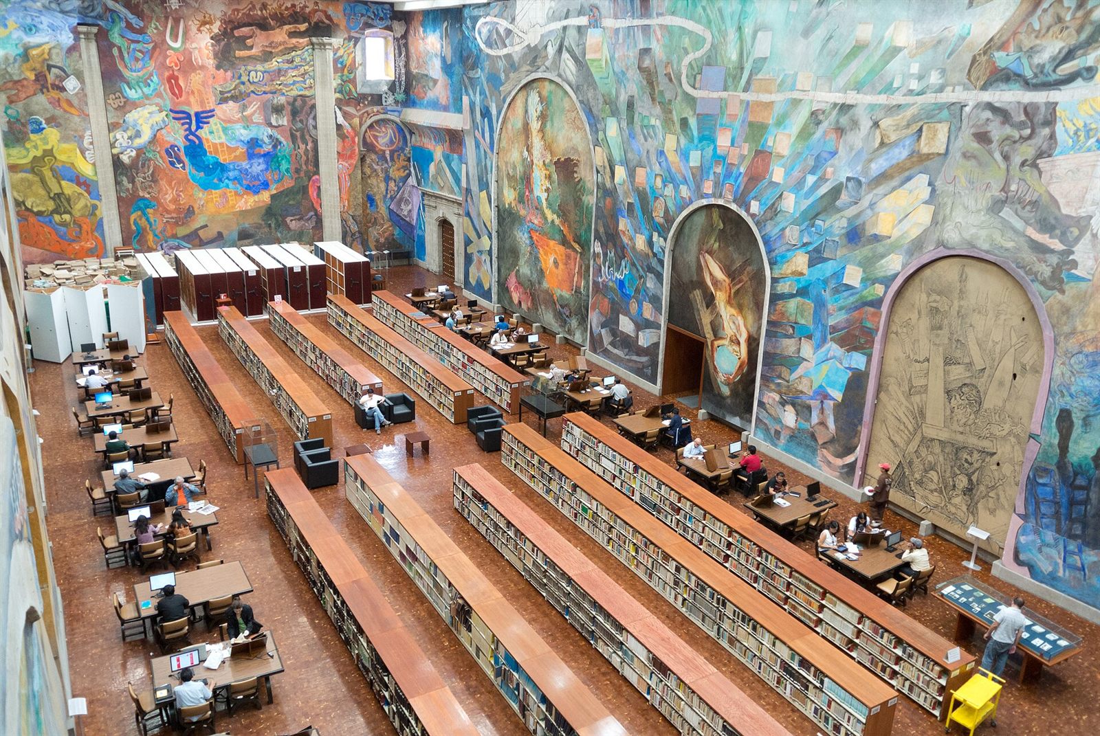 A person reading through a file in a reading room
