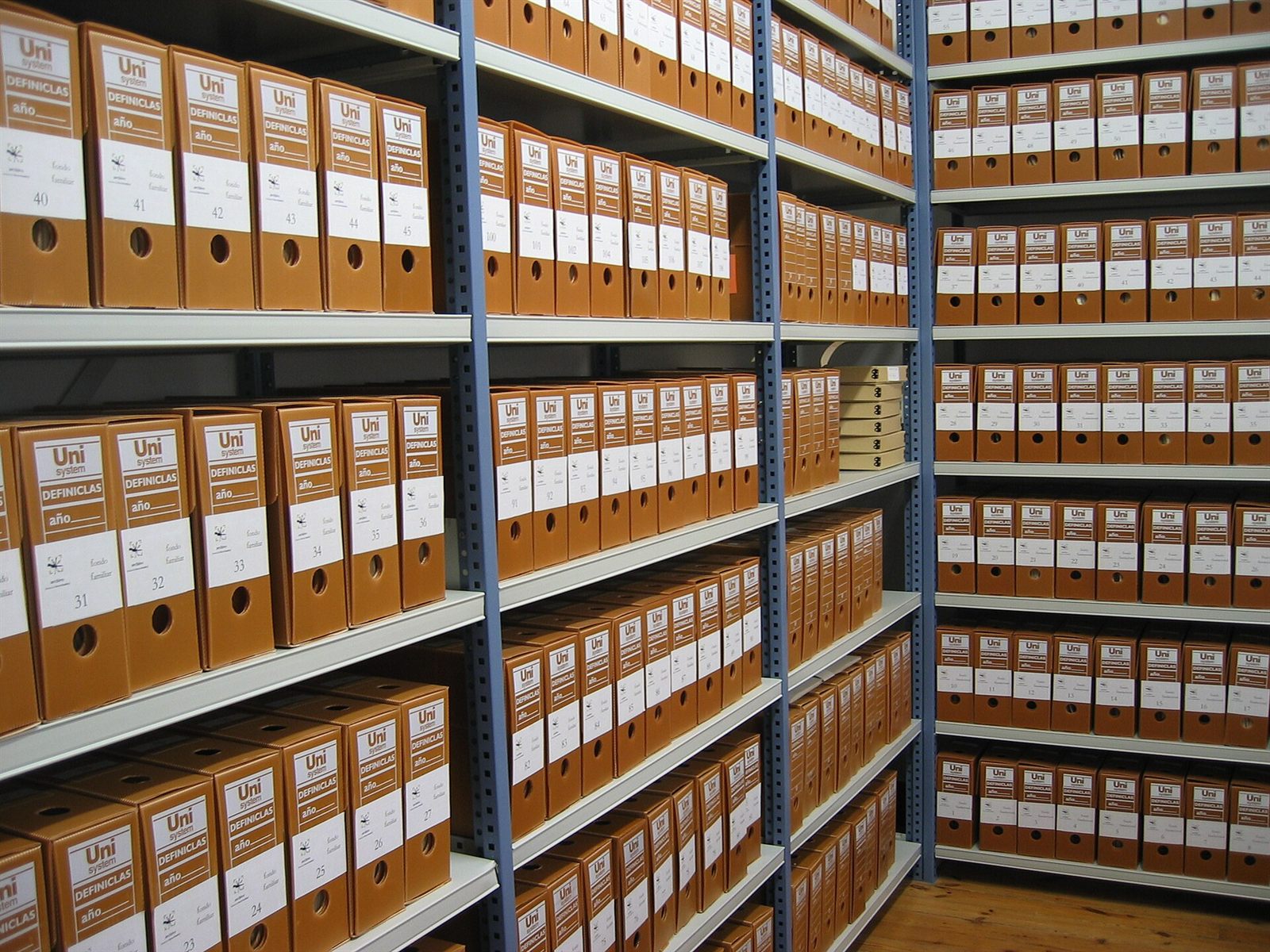 Rows of archive boxes on shelving